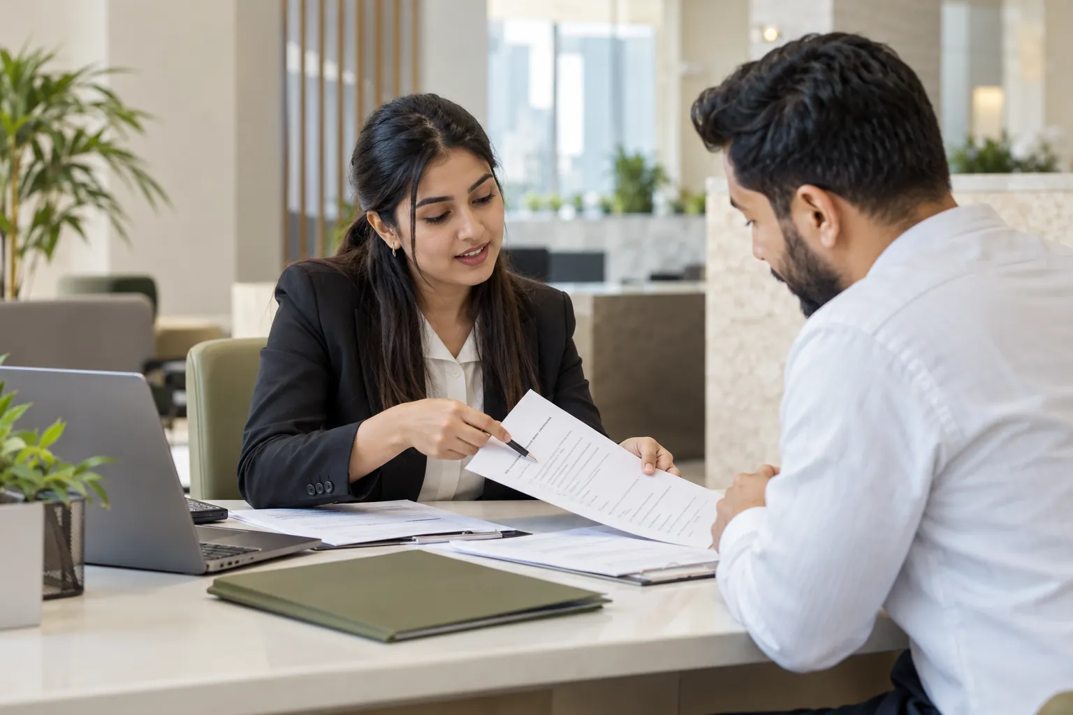 Consultant explaining a document checklist to a customer.